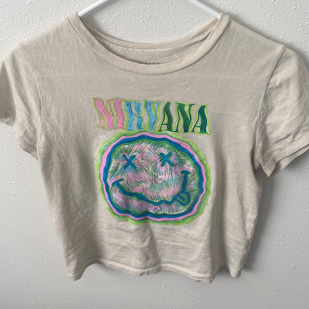 Cream colored crop top from Nirvana in a size small